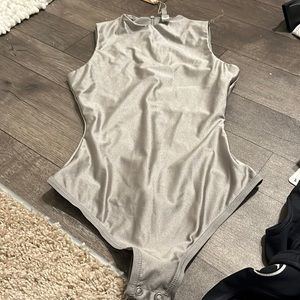 Brand new - skims metallic silver  bodysuit - never worn- great material - !